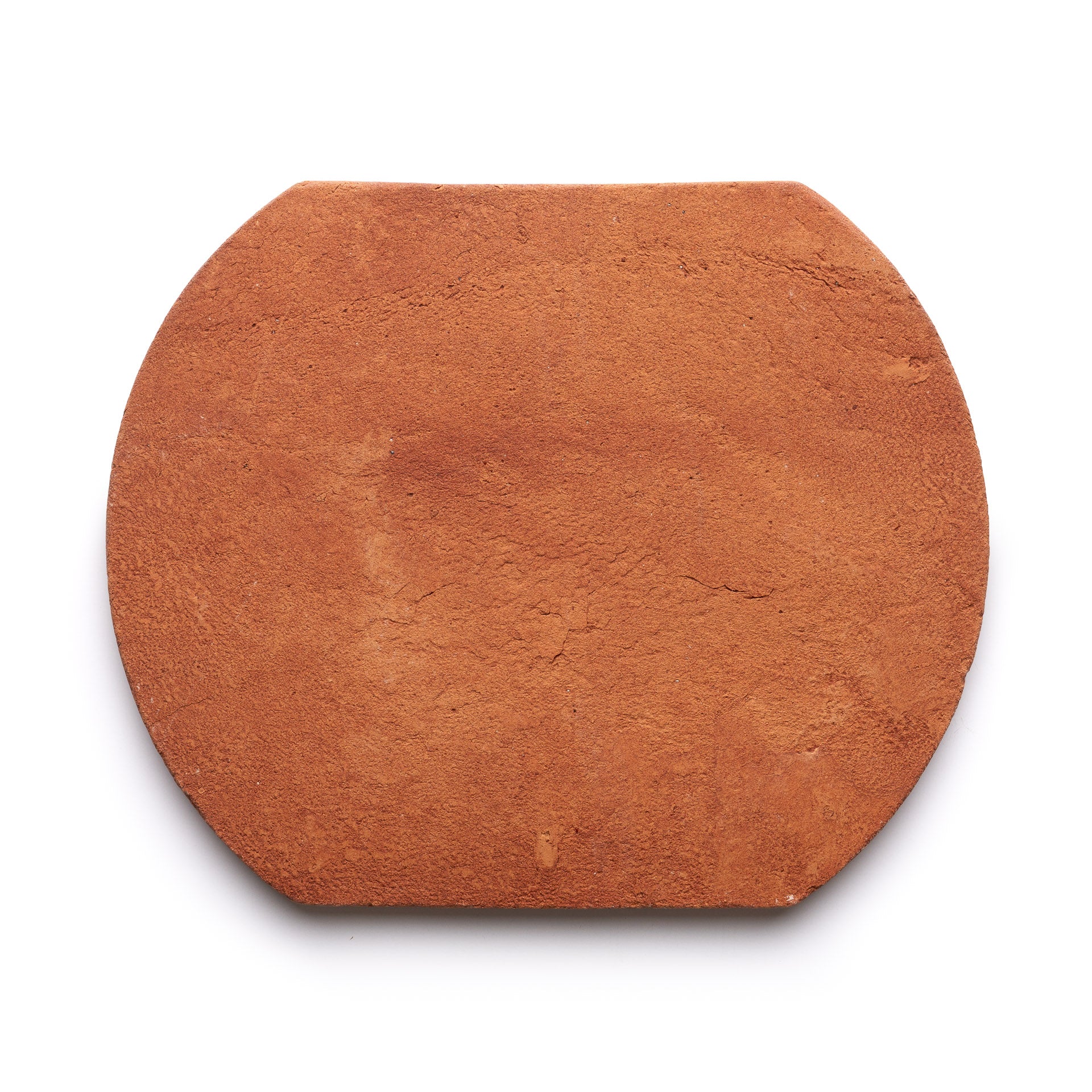 The Oaxaca + Red Clay by Zia Tile is a flat, reddish-brown, rectangular clay tile with slightly rounded edges and a smooth, textured surface, shown on a white background.