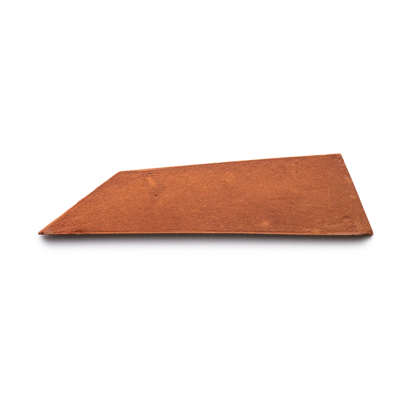 A single Tornillo + Red Clay tile by Zia Tile, featuring an irregular trapezoidal shape in terra cotta hue, displayed on a white background.