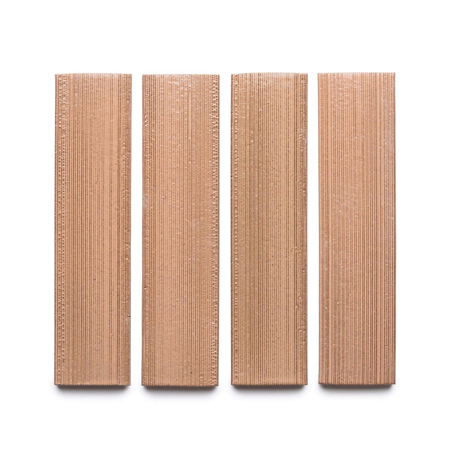 Four rectangular Sakura + Etched brown wafers from Zia Tile are arranged vertically in a row on a white background.