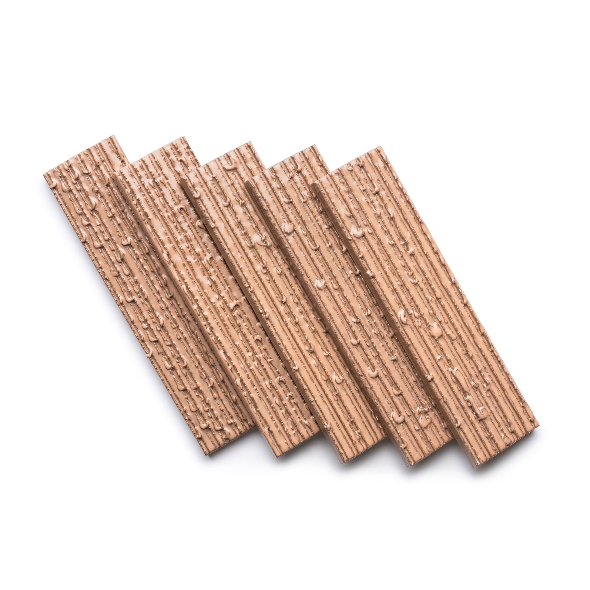 Five Sakura + Furrowed tiles by Zia Tile are displayed diagonally in a fanned-out pattern on a white background, showing off their textured, ridged surfaces and intricate patterns.