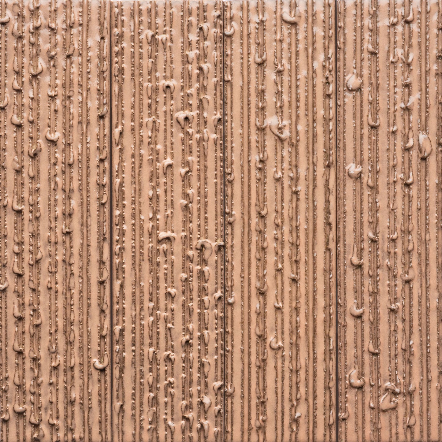 Close-up of the Sakura + Furrowed tile by Zia Tile, showing vertical textured lines with uneven streaks and lumps that create a patterned surface.