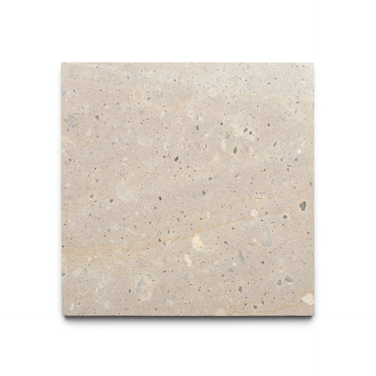 The Zia Tile Sierra 12x12 is a square, beige Mexican Cantera stone tile with natural variations and small specks, shown on a white background.