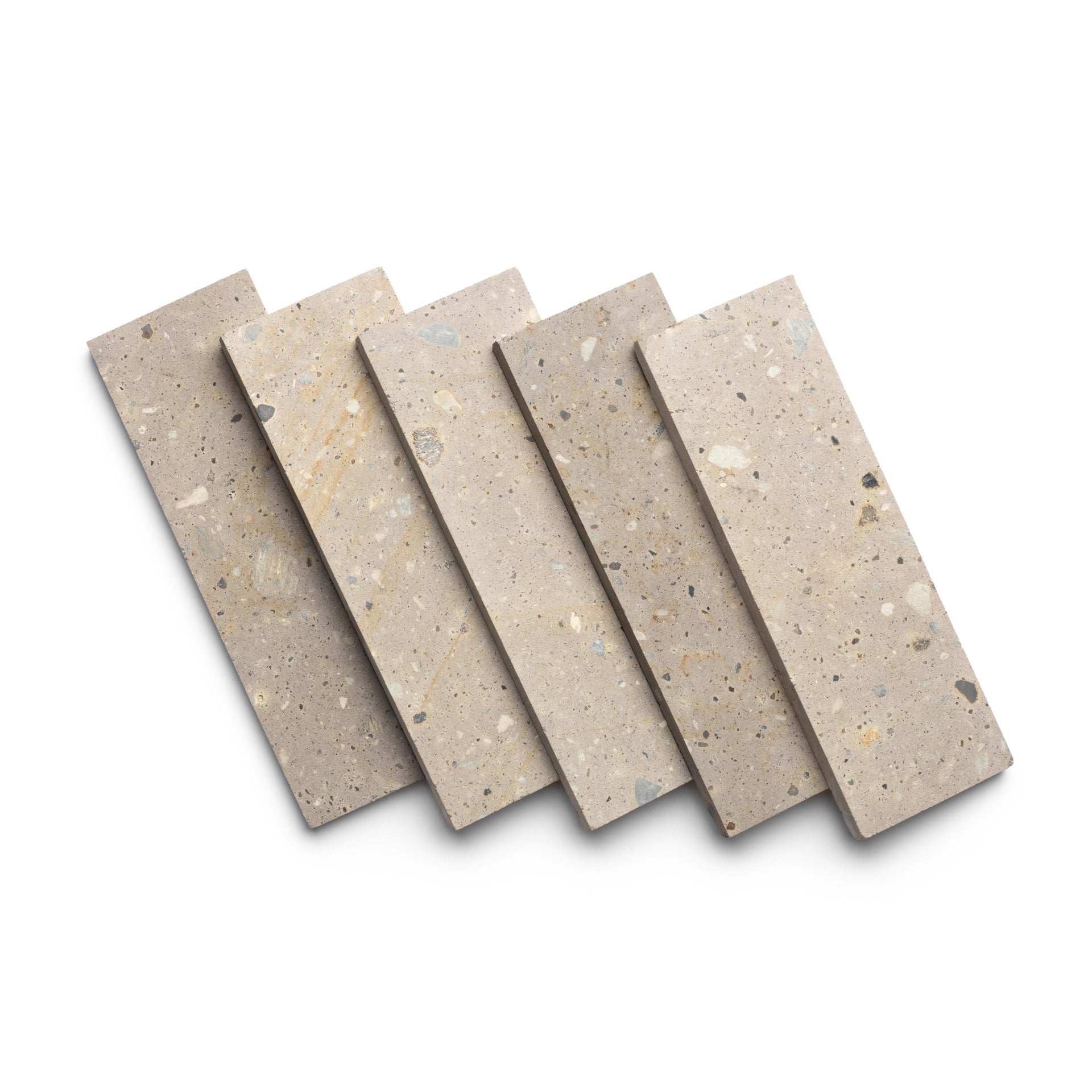Five Zia Tile Sierra 4x12 rectangular tiles in neutral tones, fanned out on a white background. The tiles have a speckled look with small fragments, highlighting the natural beauty of volcanic stone.