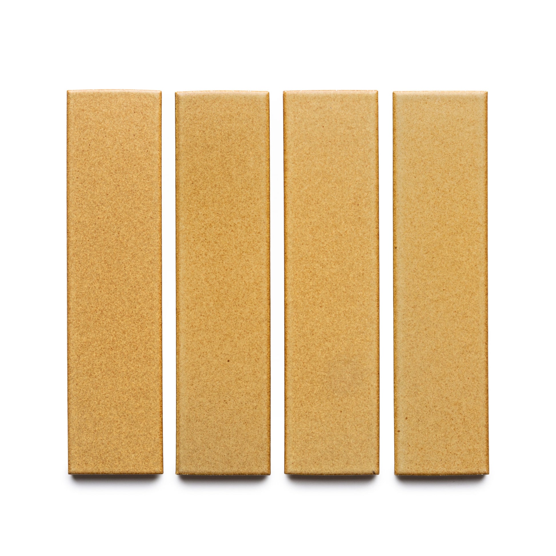 Four rectangular Toast + Flat tiles by Zia Tile, in light brown, are arranged vertically in a row on a white background.