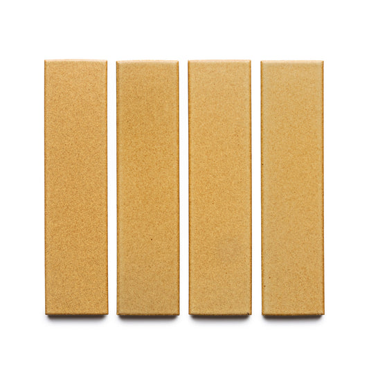 Four rectangular Toast + Flat tiles by Zia Tile, in light brown, are arranged vertically in a row on a white background.