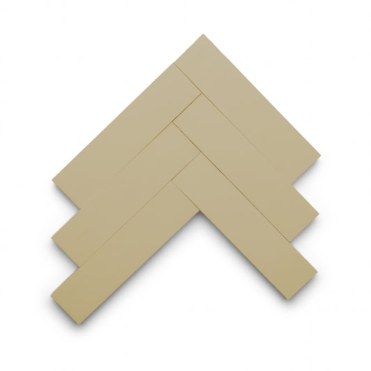 Five Truffle 2x8 rectangular tiles from Zia Tile are arranged in a herringbone pattern on a white background.