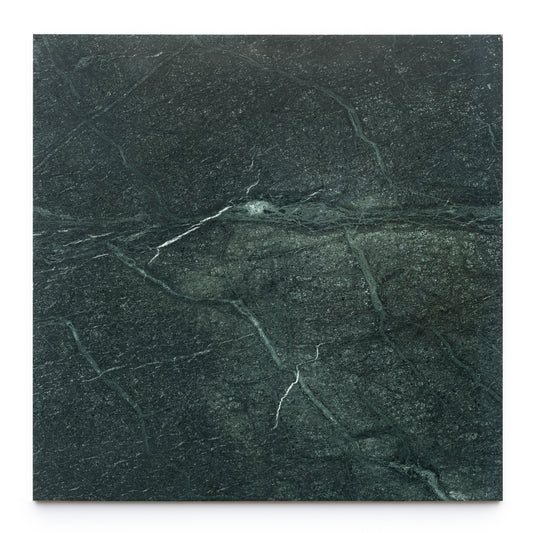 The Verde Alpi 24x24 by Zia Tile is a rectangular dark green marble tile with subtle white veins, displayed vertically against a white background to highlight its signature elegance.