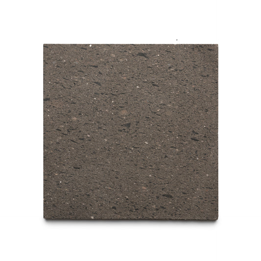 The Volcan 12x12 by Zia Tile is a square, dark brown Cantera stone tile with a slightly rough texture and subtle speckles, shown against a white background.