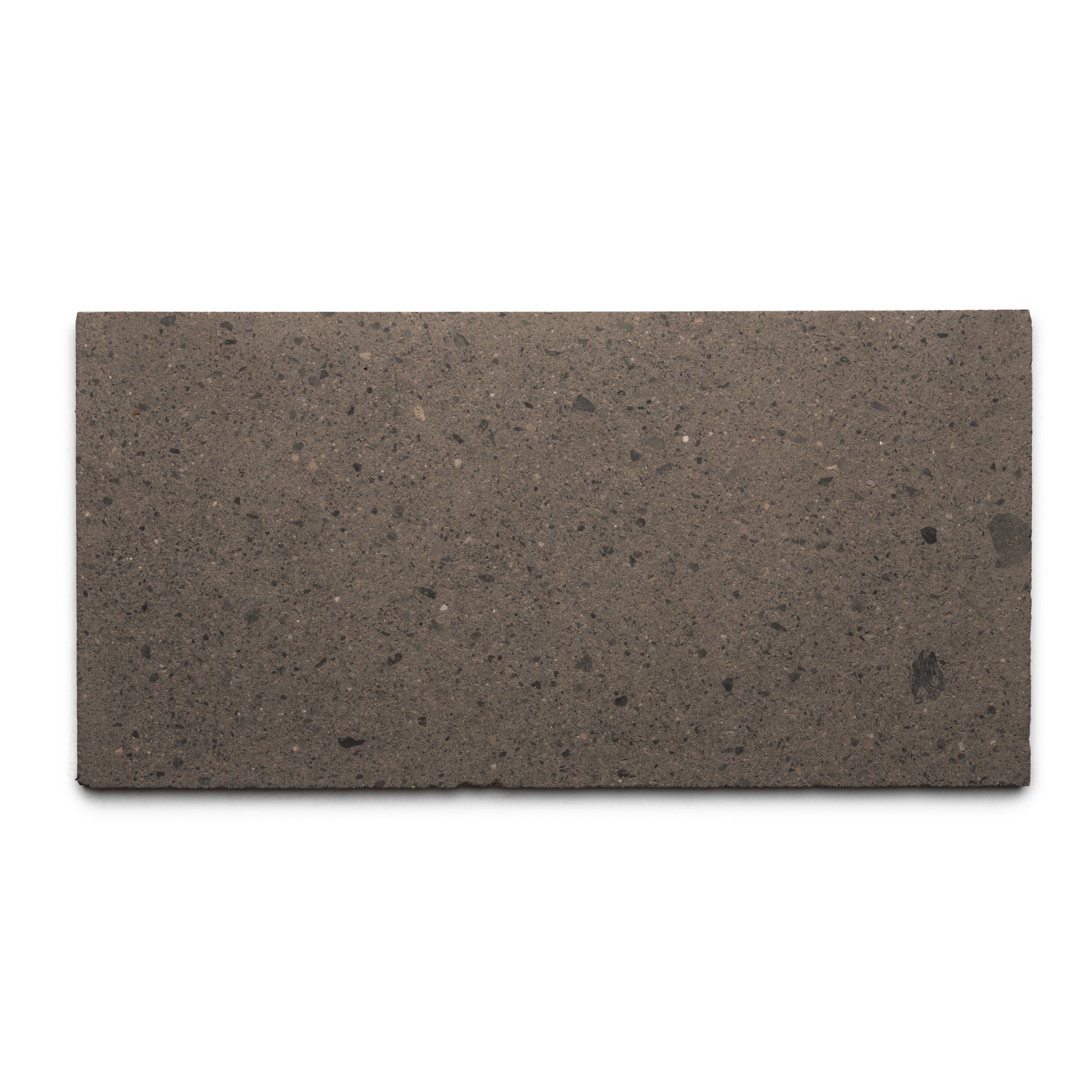 The Zia Tile Volcan 12x24 is a rectangular, flat brown tile made from natural volcanic stone with a smooth surface and subtle dark speckles, shown from above on a white background.