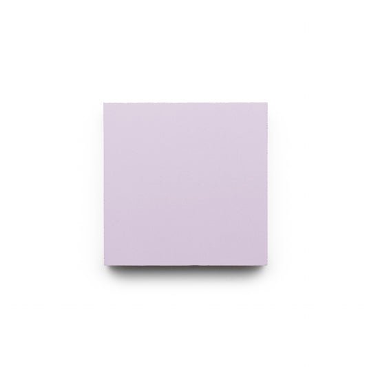 A plain, light purple Wisteria 4x4 tile by Zia Tile, resembling a handmade piece of foam, is centered on a white background.